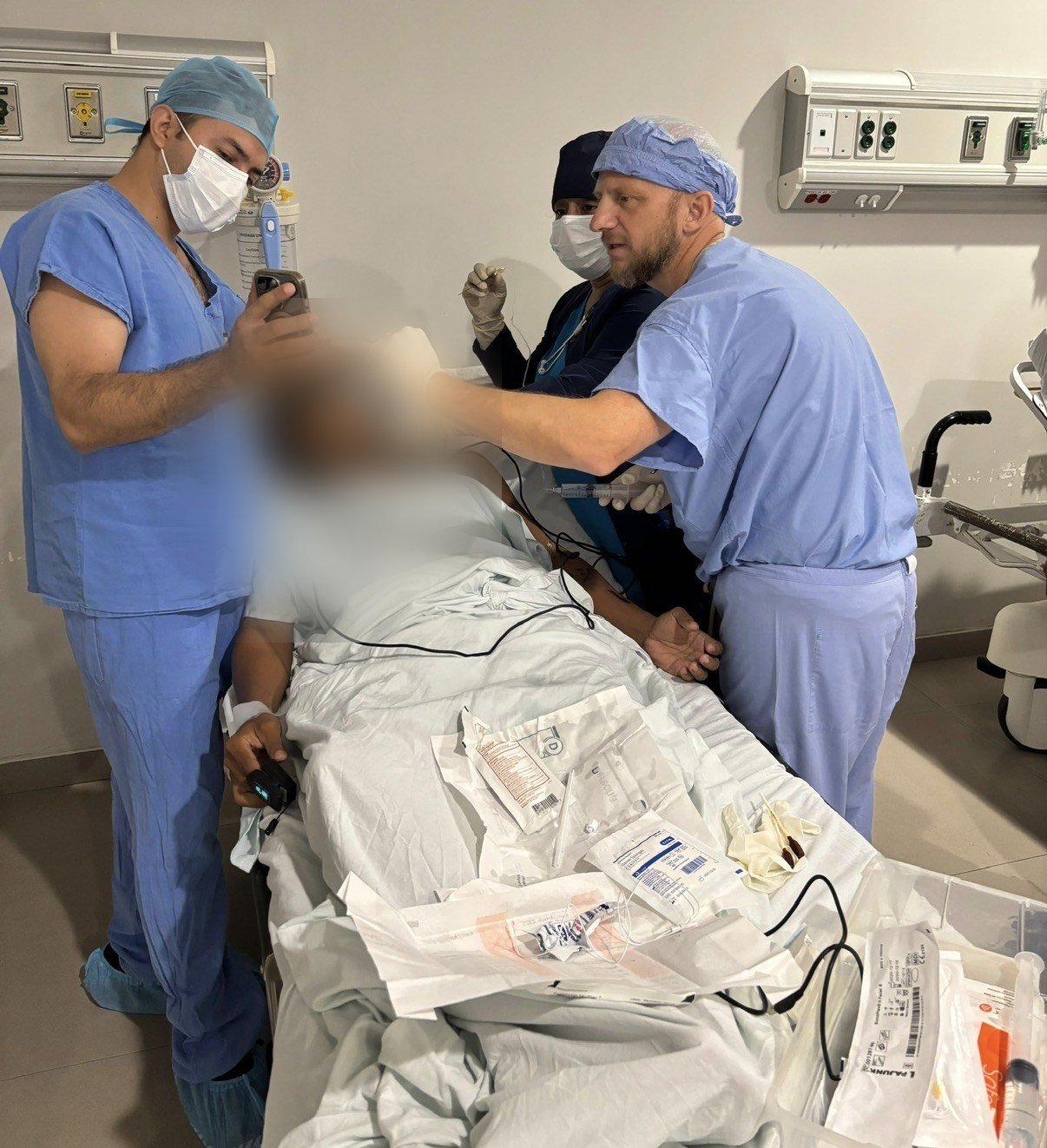 Ultrasound-guided brachial plexus block with Butterfly probe; patient face blurred