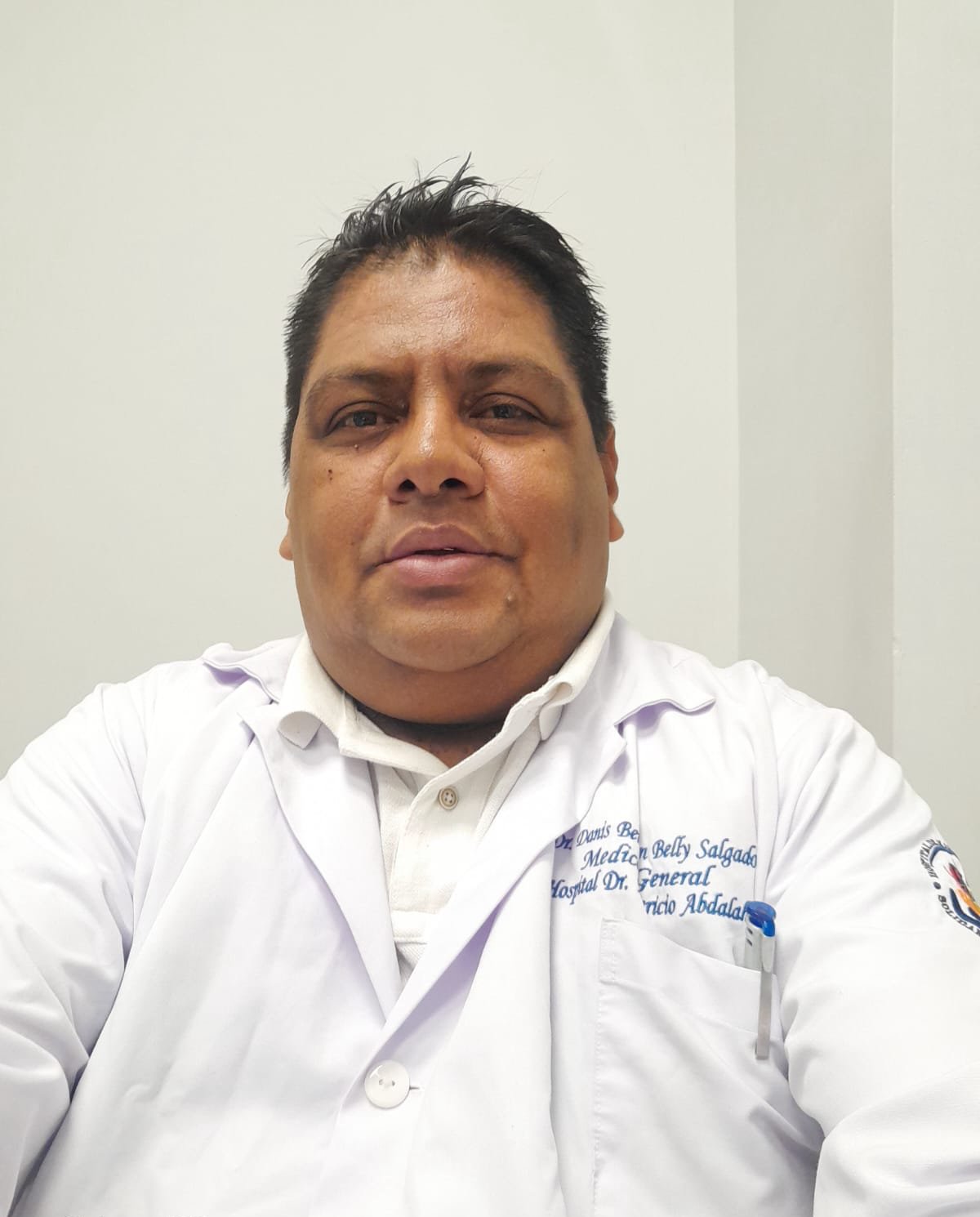 Dr. Danis Belly in a white coat
